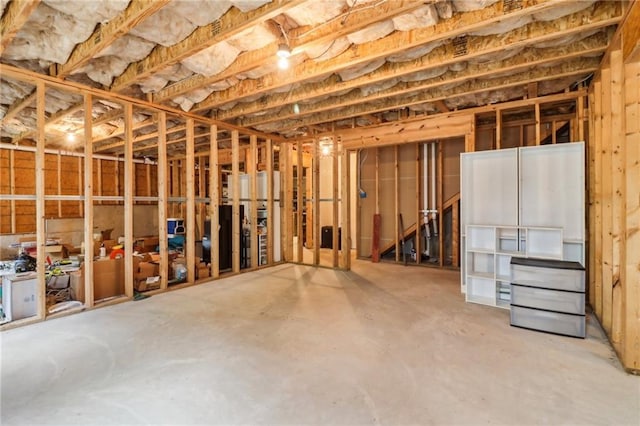 miscellaneous room featuring unfinished concrete flooring
