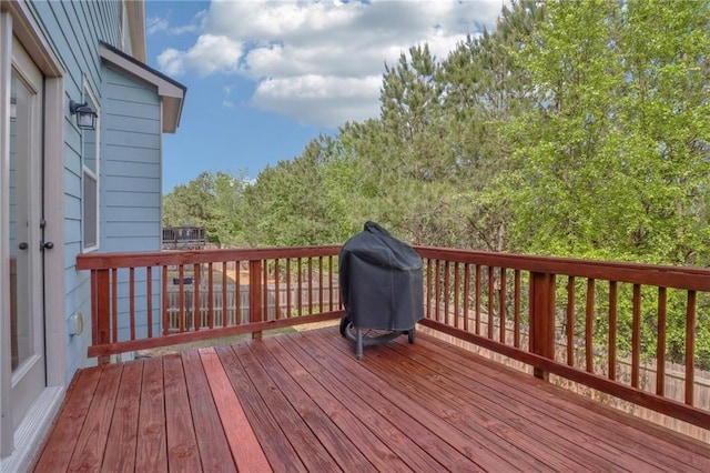 wooden deck with grilling area