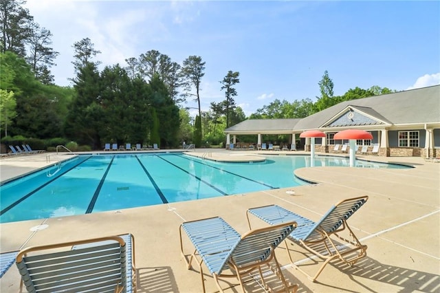 community pool with a patio area