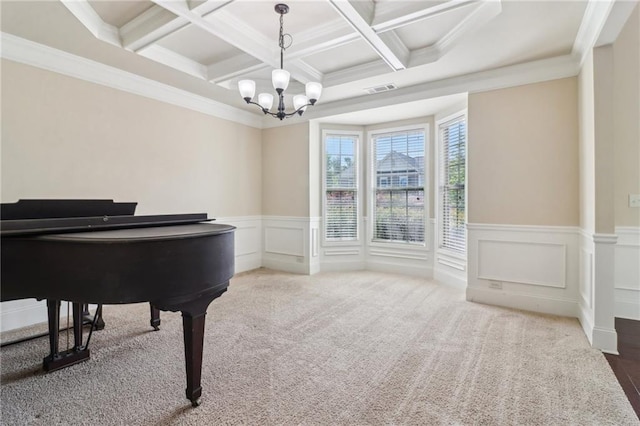 living area featuring visible vents, crown molding, beam ceiling, a chandelier, and coffered ceiling