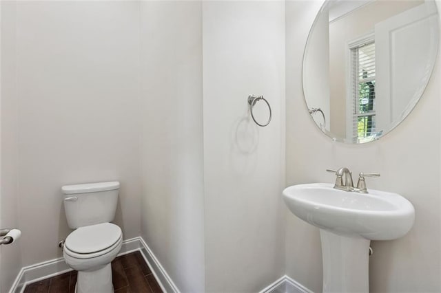 2040 Birchdale Dr, Milton, GA 30004 - half bathroom featuring toilet, wood tiled floors, and baseboards