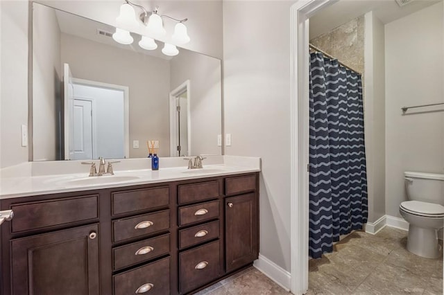 2040 Birchdale Dr, Milton, GA 30004 - bathroom with double vanity, toilet, baseboards, and a shower with curtain
