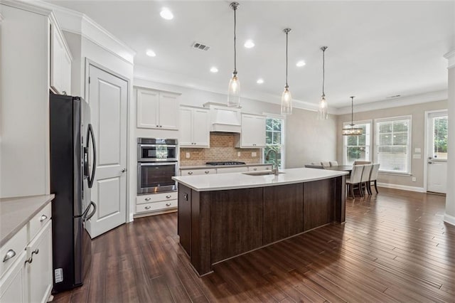 2040 Birchdale Dr, Milton, GA 30004 - kitchen with appliances with stainless steel finishes, light countertops, a sink, tasteful backsplash, and healthy amount of natural light