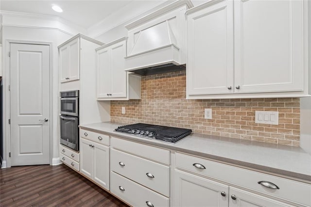2040 Birchdale Dr, Milton, GA 30004 - kitchen featuring stainless steel appliances, custom range hood, light countertops, ornamental molding, and white cabinets