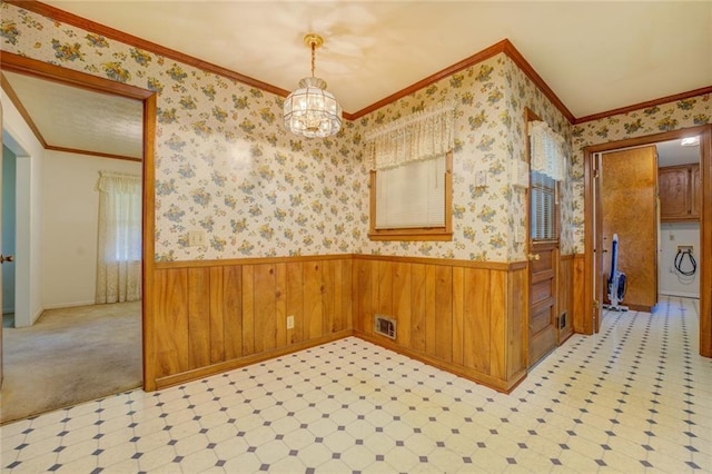 1830 Francis Rd SW, Conyers, GA 30094 - unfurnished dining area with wainscoting, a chandelier, wallpapered walls, light flooring, and crown molding