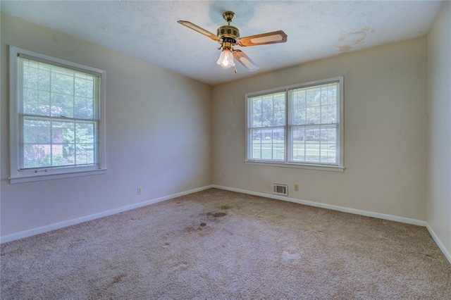 1830 Francis Rd SW, Conyers, GA 30094 - carpeted empty room featuring a ceiling fan and a textured ceiling