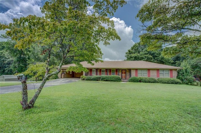 1830 Francis Rd SW, Conyers, GA 30094 - ranch-style home with driveway, a front lawn, and a carport