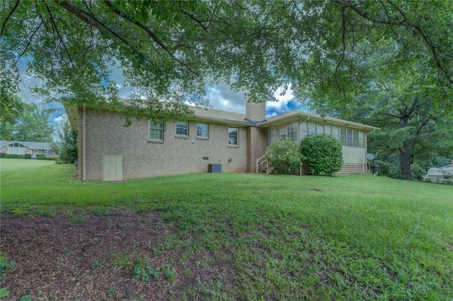 1830 Francis Rd SW, Conyers, GA 30094 - rear view of house with crawl space, a chimney, a yard, and brick siding
