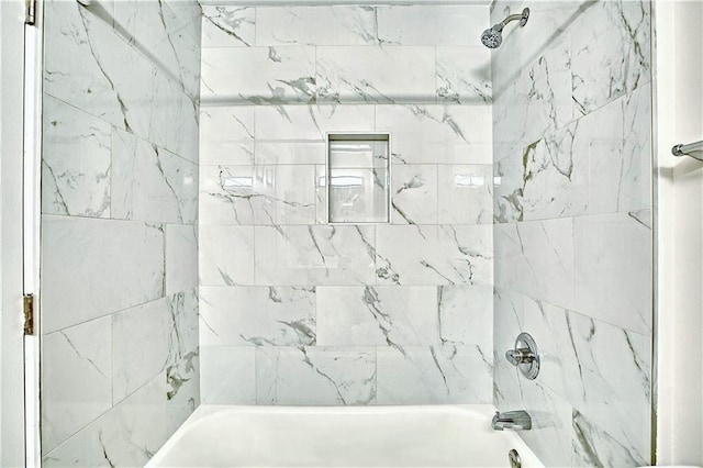 bathroom with shower / bath combination