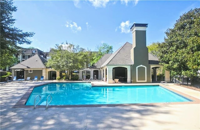 pool featuring a patio area