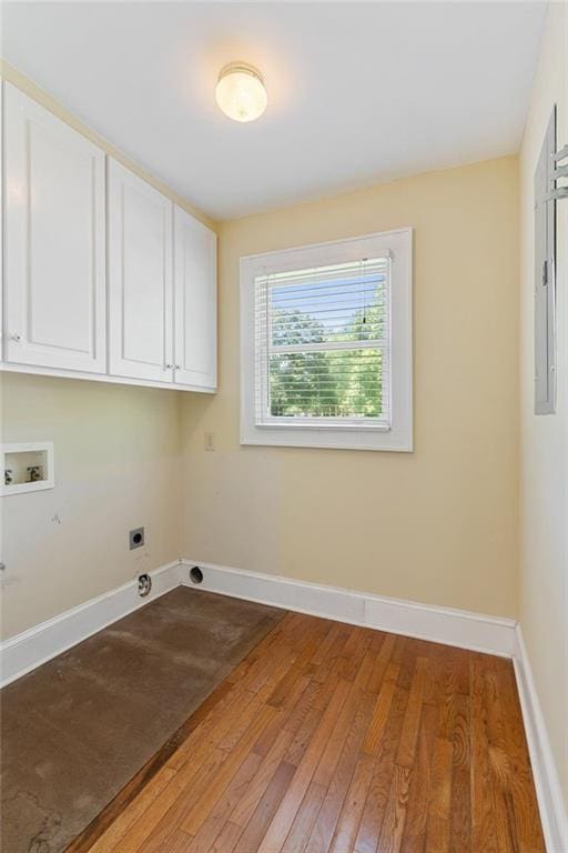 2055 Cactus Ln, Cumming, GA 30040 - washroom featuring cabinet space, hookup for a washing machine, hookup for an electric dryer, light wood-style floors, and baseboards