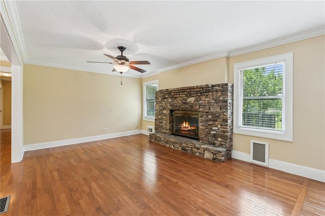 2055 Cactus Ln, Cumming, GA 30040 - unfurnished living room featuring wood finished floors, a fireplace, crown molding, ceiling fan, and baseboards