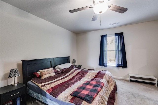 bedroom featuring ceiling fan and carpet