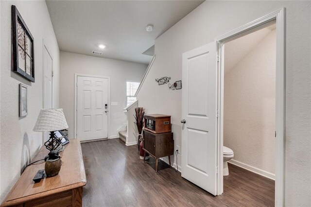 entrance foyer with dark hardwood / wood-style floors