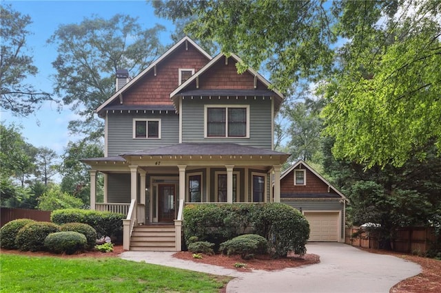 47 Oakridge Ave SE, Atlanta, GA 30317 - view of front of house with covered porch, a chimney, a garage, and driveway