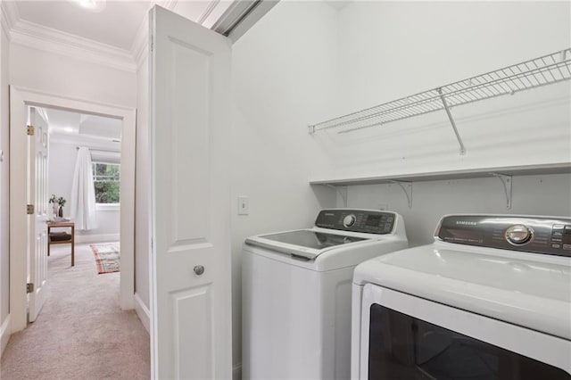 47 Oakridge Ave SE, Atlanta, GA 30317 - laundry room featuring independent washer and dryer, ornamental molding, and light colored carpet