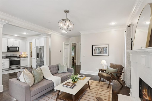 47 Oakridge Ave SE, Atlanta, GA 30317 - living area with dark wood finished floors, crown molding, a premium fireplace, recessed lighting, and a chandelier