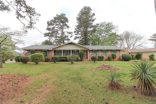 ranch-style home with a front lawn and brick siding