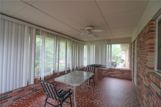 sunroom with a ceiling fan