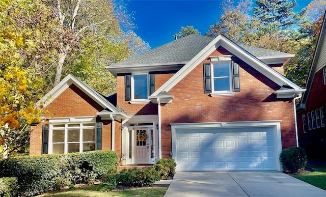 view of front of property with a garage