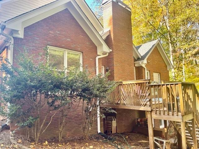 view of home's exterior featuring a deck