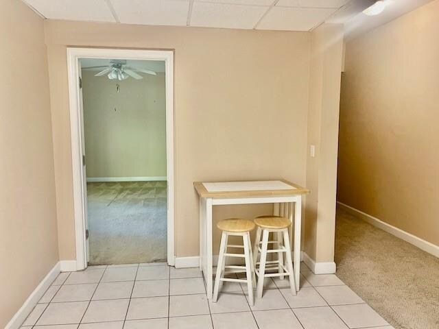 bathroom with tile patterned floors and vanity