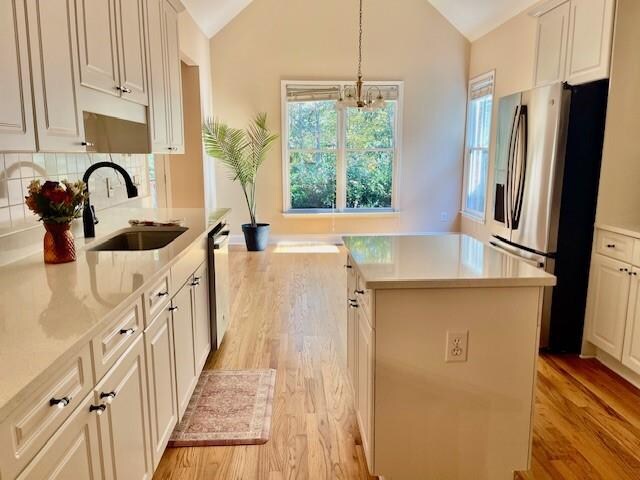 empty room with hardwood / wood-style floors and crown molding