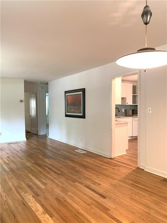 3604 Orchard Cir, Decatur, GA 30032 - unfurnished living room featuring light wood-style floors