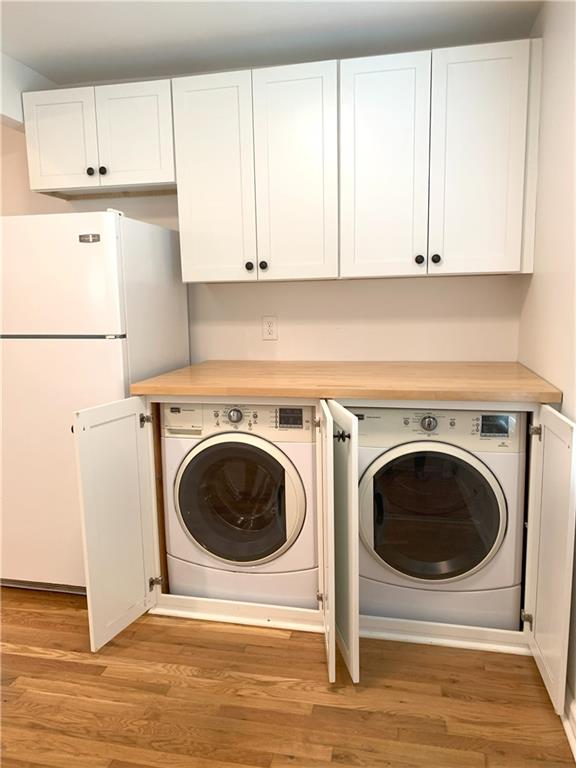 3604 Orchard Cir, Decatur, GA 30032 - laundry room featuring independent washer and dryer and light wood-style flooring