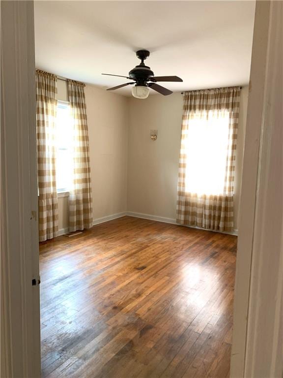 3604 Orchard Cir, Decatur, GA 30032 - empty room featuring plenty of natural light, ceiling fan, and wood finished floors
