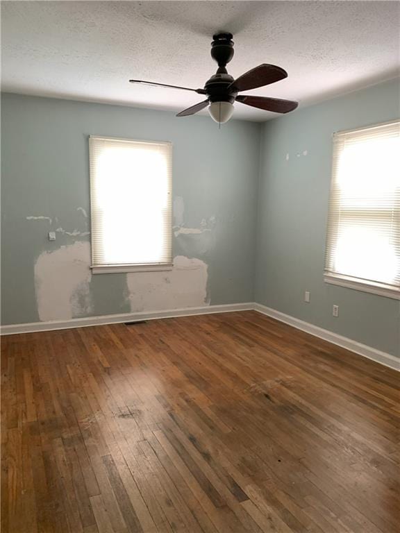 3604 Orchard Cir, Decatur, GA 30032 - unfurnished room with plenty of natural light, hardwood / wood-style floors, ceiling fan, and a textured ceiling