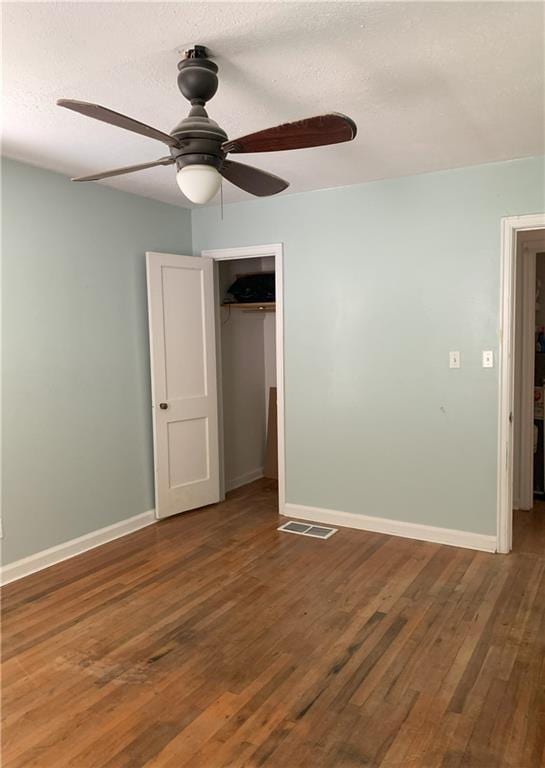 3604 Orchard Cir, Decatur, GA 30032 - unfurnished bedroom with a closet, wood finished floors, and a ceiling fan