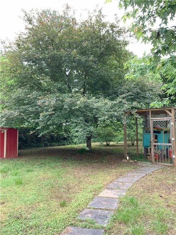 3604 Orchard Cir, Decatur, GA 30032 - view of green lawn with a storage shed