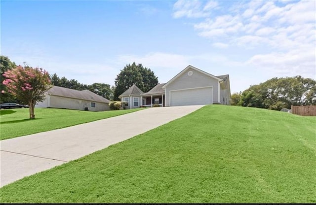 ranch-style house featuring a front yard and a garage