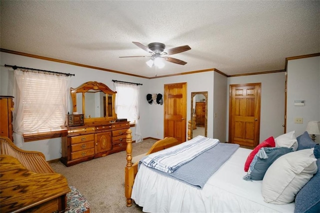 bedroom featuring a textured ceiling, ornamental molding, baseboards, and light carpet