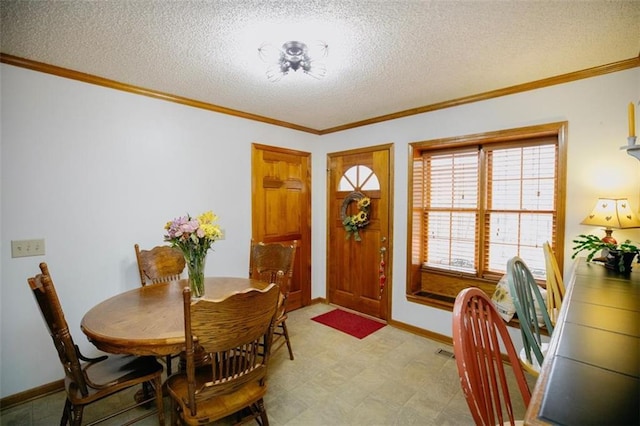 dining space featuring light floors, a textured ceiling, crown molding, and baseboards