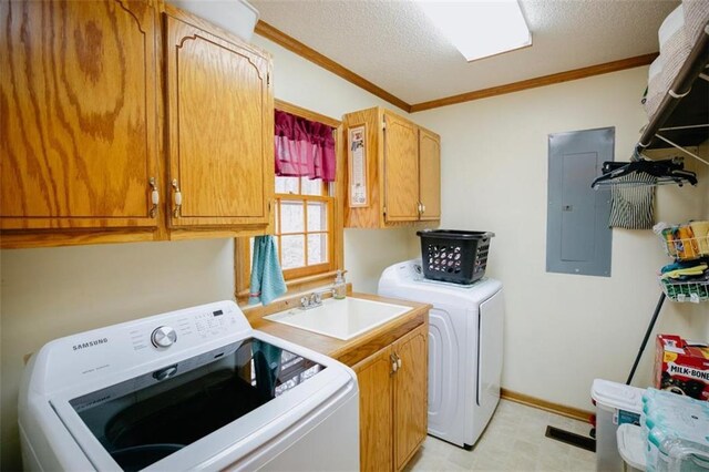 laundry room with washer and clothes dryer, electric panel, a sink, cabinet space, and crown molding