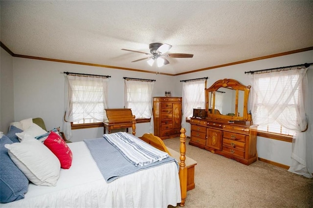 bedroom with light carpet, a textured ceiling, ornamental molding, and a ceiling fan