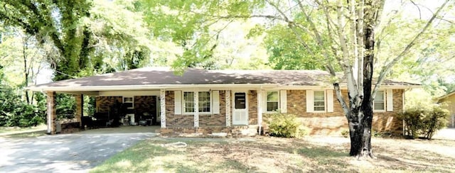 811 Verde Dr, Riverdale, GA 30274 - ranch-style home featuring a carport, brick siding, and aphalt driveway