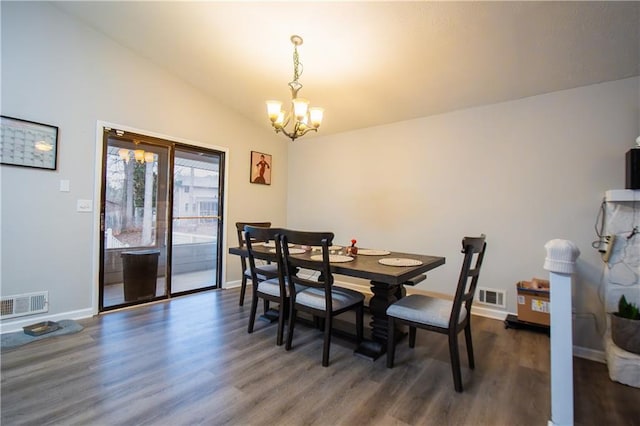 dining room with dark wood finished floors, visible vents, vaulted ceiling, and a notable chandelier