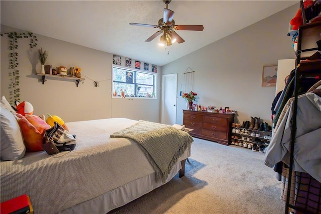 bedroom featuring vaulted ceiling, carpet floors, and a ceiling fan