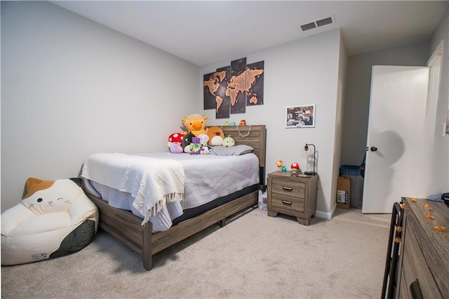 bedroom featuring visible vents and light colored carpet