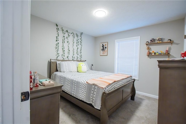 carpeted bedroom with baseboards