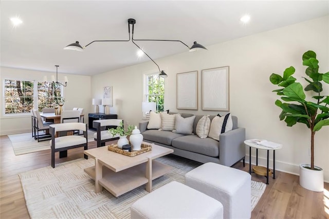 living area with light wood finished floors and baseboards