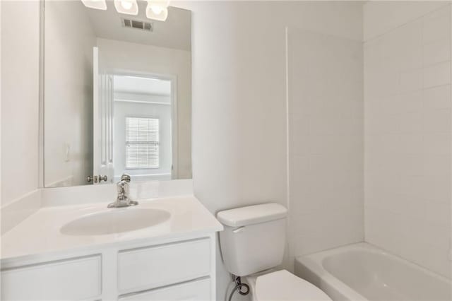 full bathroom with visible vents, shower / bathing tub combination, vanity, and toilet