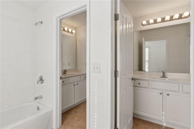 full bath with tile patterned flooring, shower / bathing tub combination, and vanity