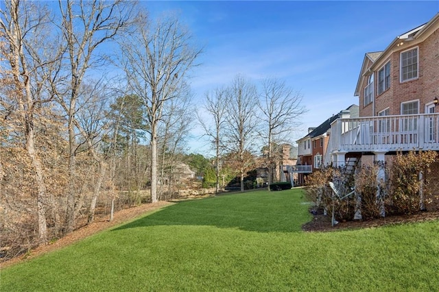 view of yard with a wooden deck