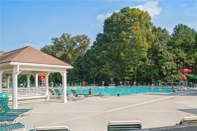 pool featuring a patio, a gazebo, and fence