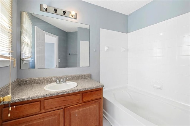 bathroom with tub / shower combination and vanity