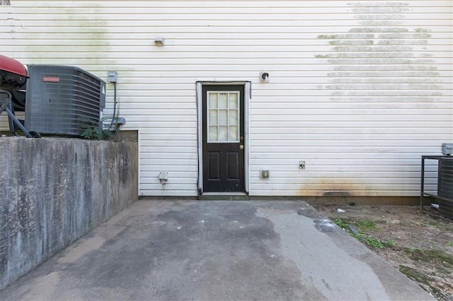 property entrance featuring a patio area and central AC